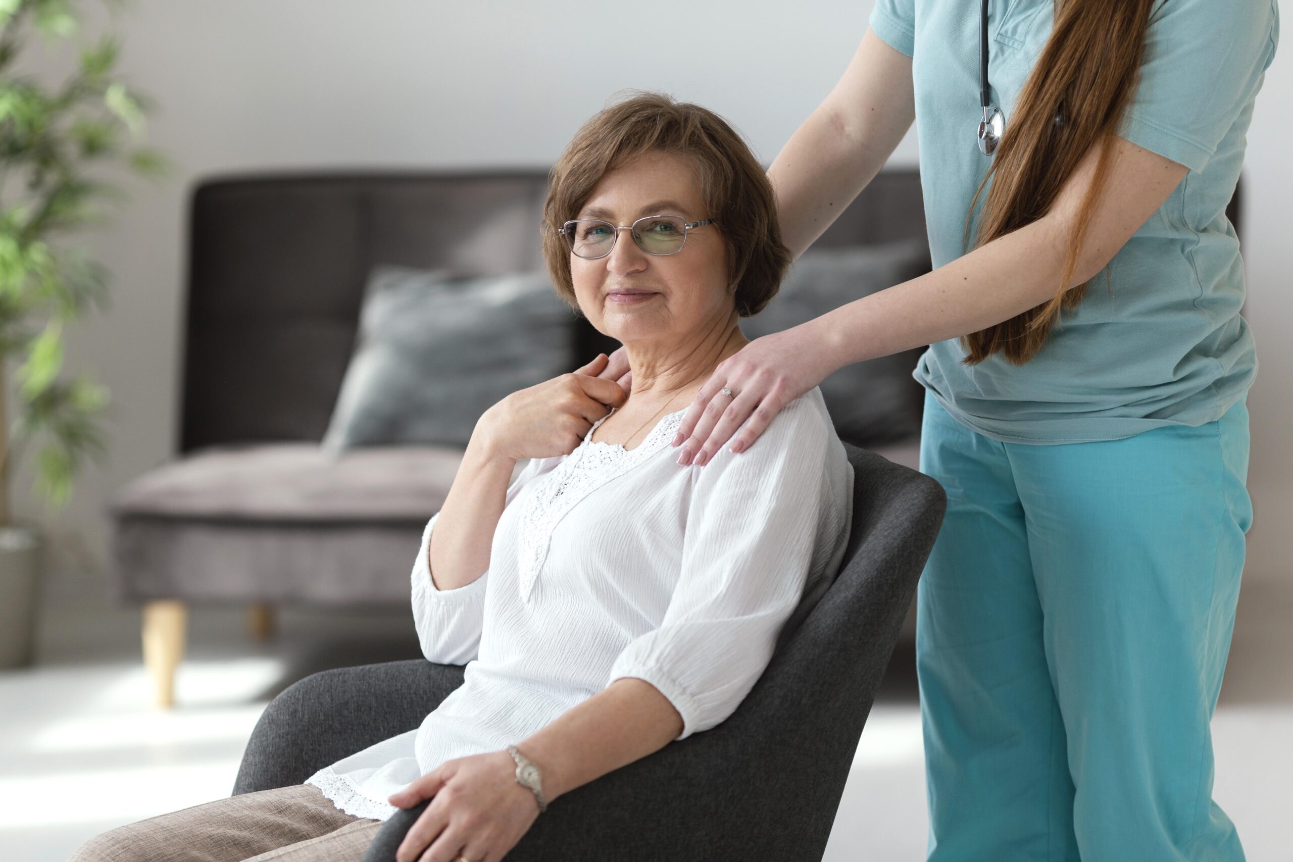 Care professional providing compassionate support to a senior